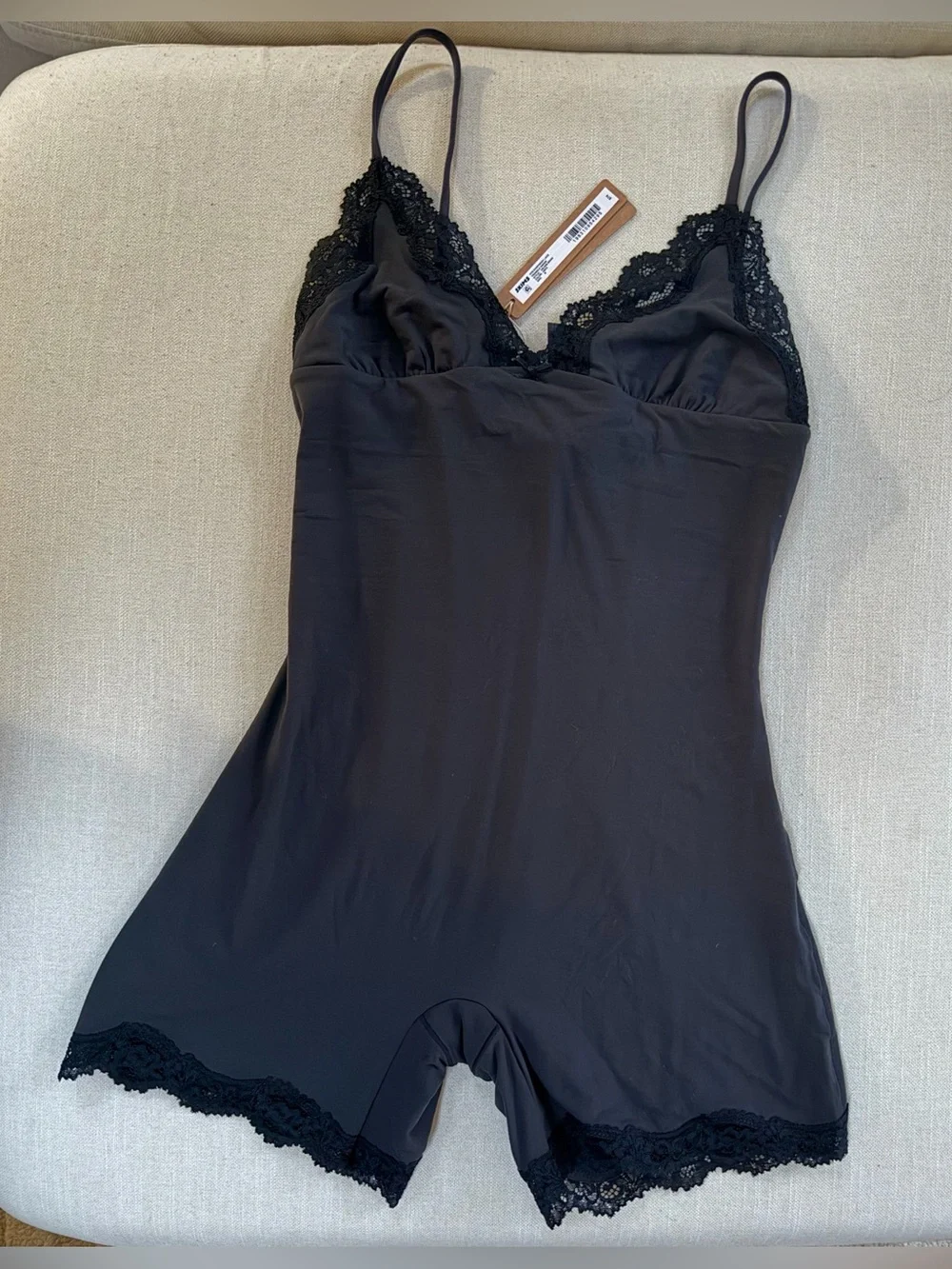 SKIMS Black fits everybody triangle onsie